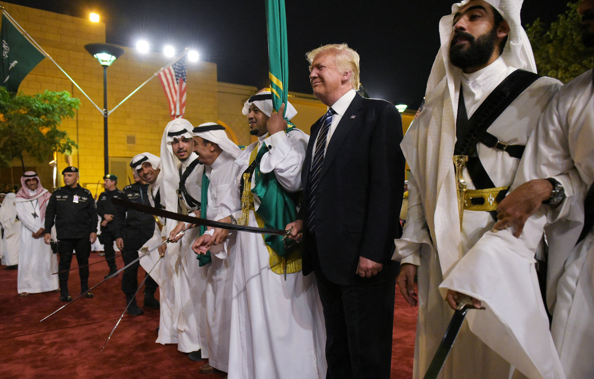 President Trump joins dancers with swords at a welcome ceremony Riyadh on May 20, 2017, when he first visited the Kingdom. (AFP)