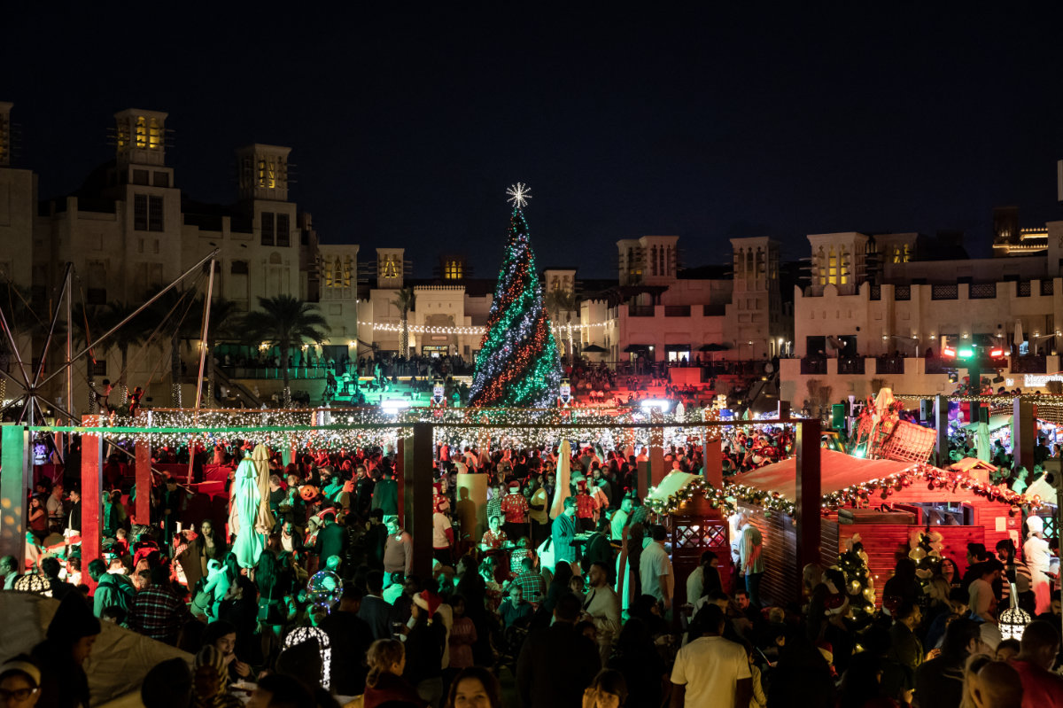 People visit a Christmas market in Souk Madinat Jumeirah in Dubai on Dec. 22, 2024. (AFP)