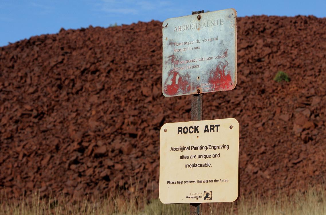 Aboriginal site preservation signs stand near the entrance to Deep Gorge on the Burrup Peninsula in the north of Western Australia on June 16, 2008. (AFP file photo)