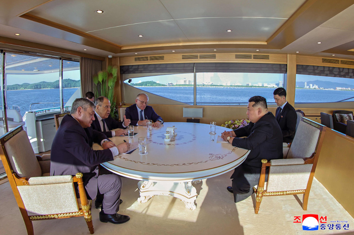 This picture taken on July 12, 2025 shows North Korean leader Kim Jong Un meeting with Russian Foreign Minister Sergei Lavrov (2nd L) in Wonsan, North Korea. (KCNA VIA KNS / AFP)