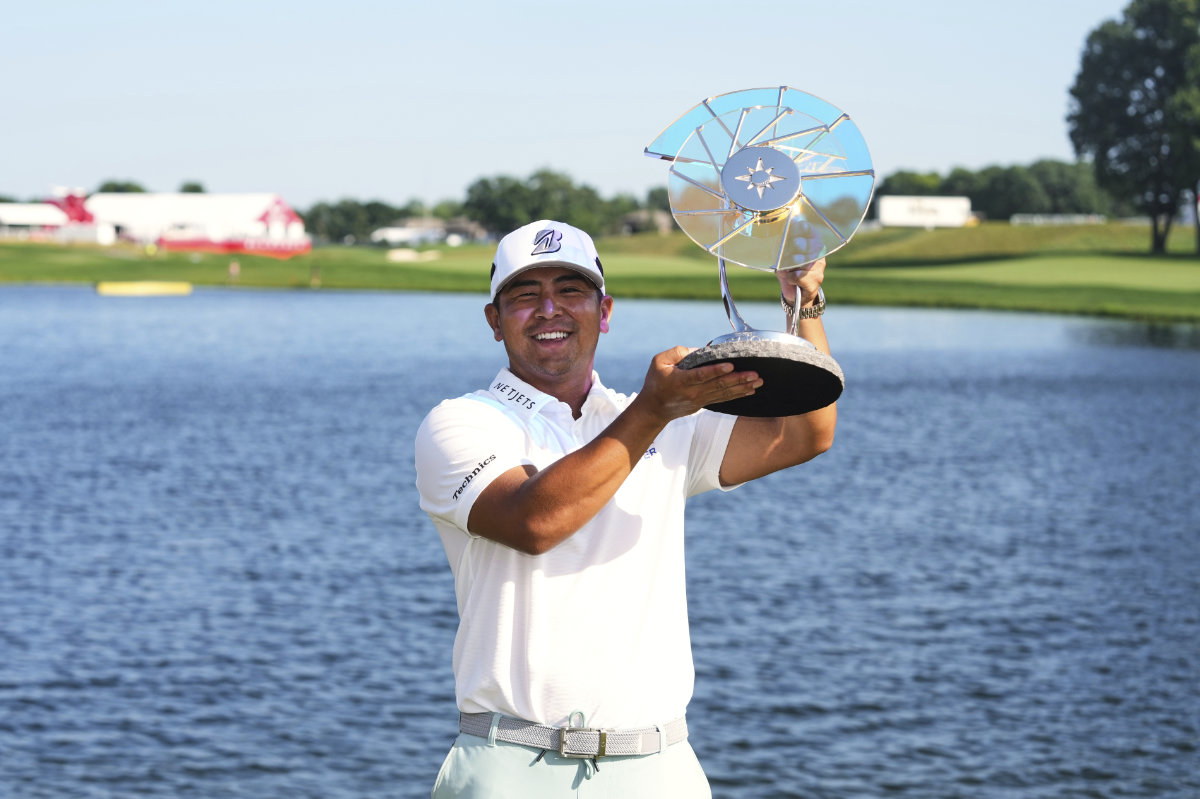 Kurt Kitayama holds up his trophy after winning the 3M Open golf tournament at the Tournament Players Club Son July 27, 2025, in Blaine, Minn. (AP)