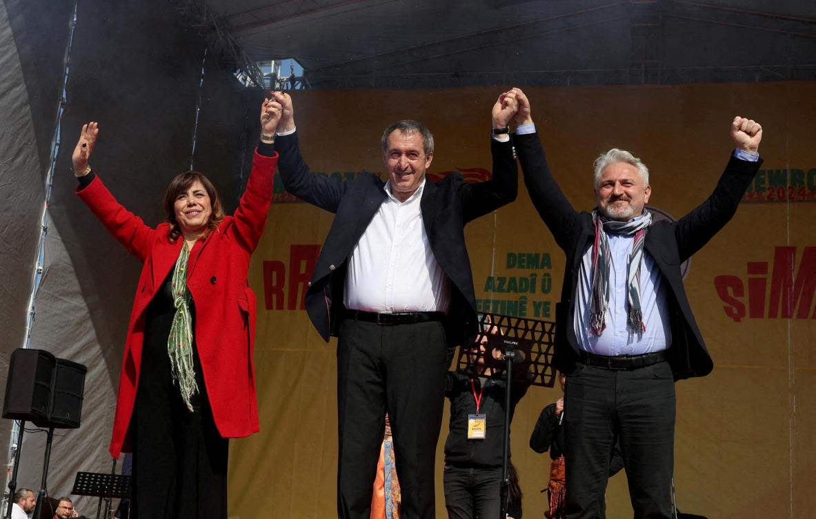 FILE PHOTO: Tuncer Bakirhan, co-chair of pro-Kurdish Peoples' Equality and Democracy Party (DEM Party) and his party's Istanbul mayoral candidates Meral Danis Bestas and Murat Cepni greet their supporters during a rally to celebrate Nowruz, which marks the arrival of spring, in Istanbul, Turkey, March 17, 2024. REUTERS/Umit Bektas/File Photo