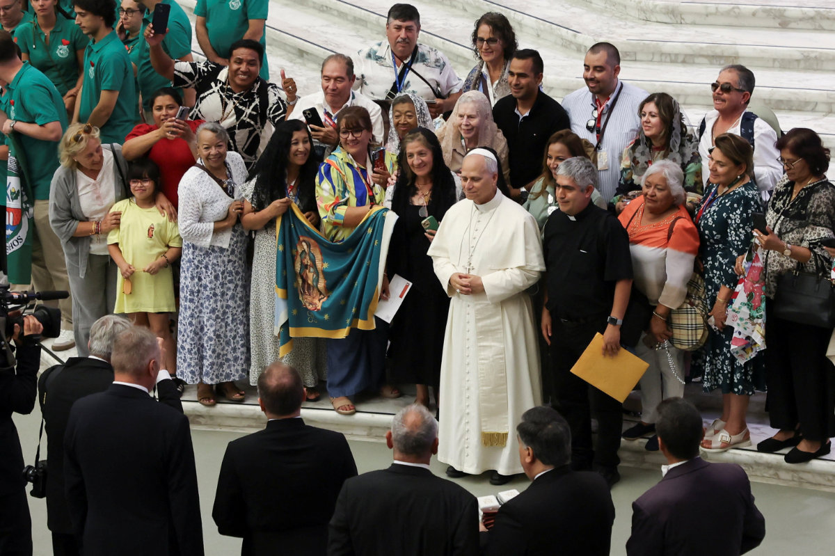 Pope Leo XIV stands with faithful during general audience in the Paul VI hall at the Vatican, Aug. 20, 2025. (REUTERS)