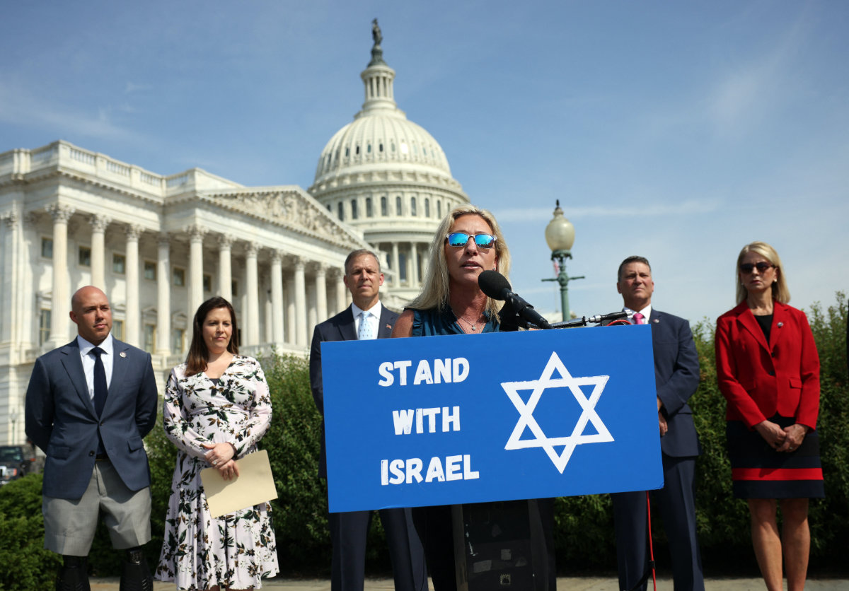 Rep. Marjorie Taylor Green, an avid supporter of Israel, is now questioning excessive US support for Israel's wars. (AFP)