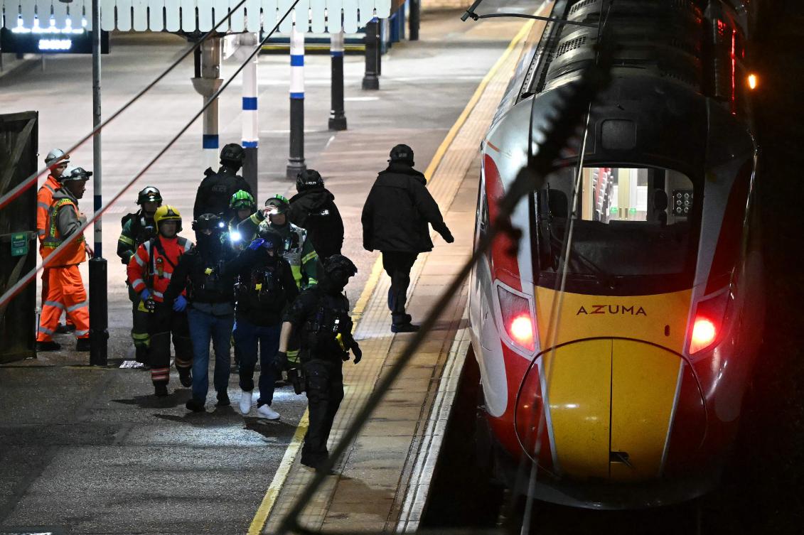 The attack caused chaos as bloodied passengers spilled out of the train during an emergency stop in Huntingdon. (AFP)