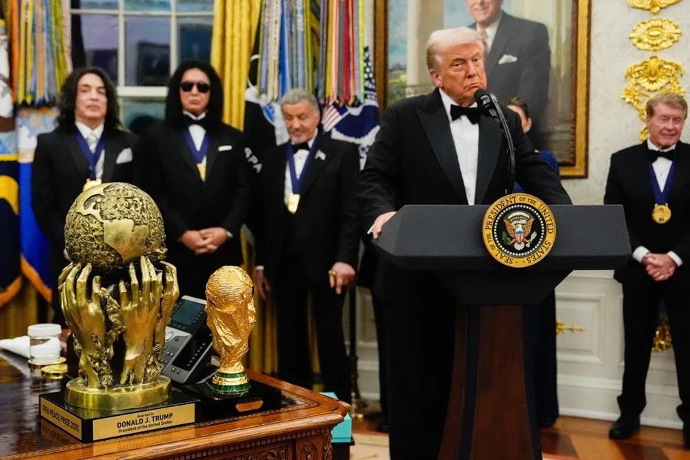 The president placed around each honoree’s neck a new medal that was designed, created and donated by jeweler Tiffany & Co., according to the Kennedy Center and Trump. (AP)