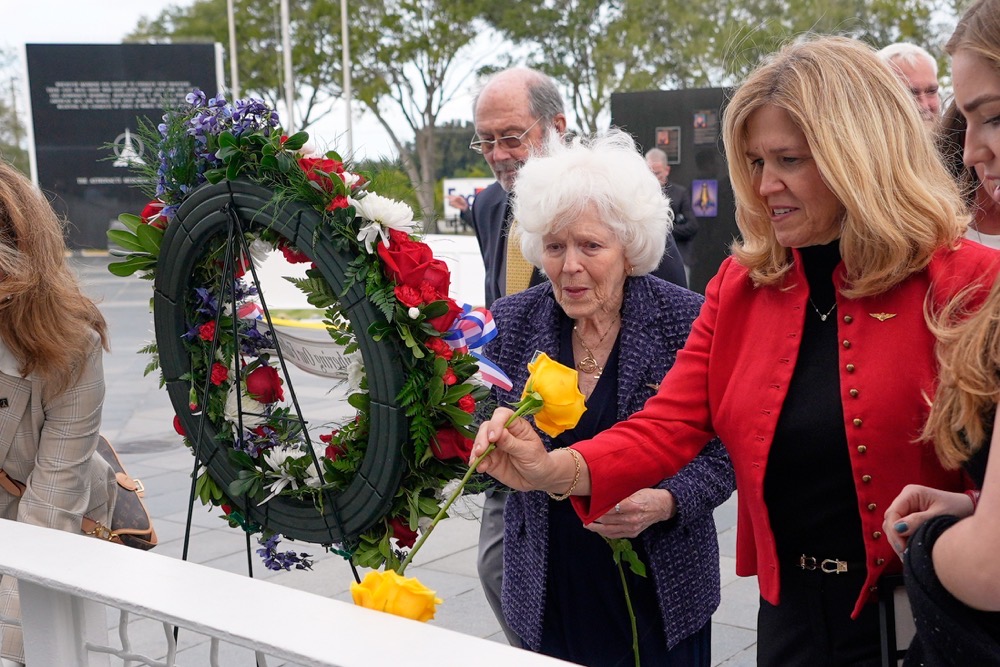 Jane Smith-Wolcott, center, widow of Challenger pilot Michael Smith and daughter Alison Smith Balch put flowers on a memorial during NASA’s Day of Remembrance for the 40th Anniversary of the Challenger tragedy at the Kennedy Space Center Visitor Complex in Cape Canaveral, Fla., Thursday, Jan. 22, 2026. (AP)