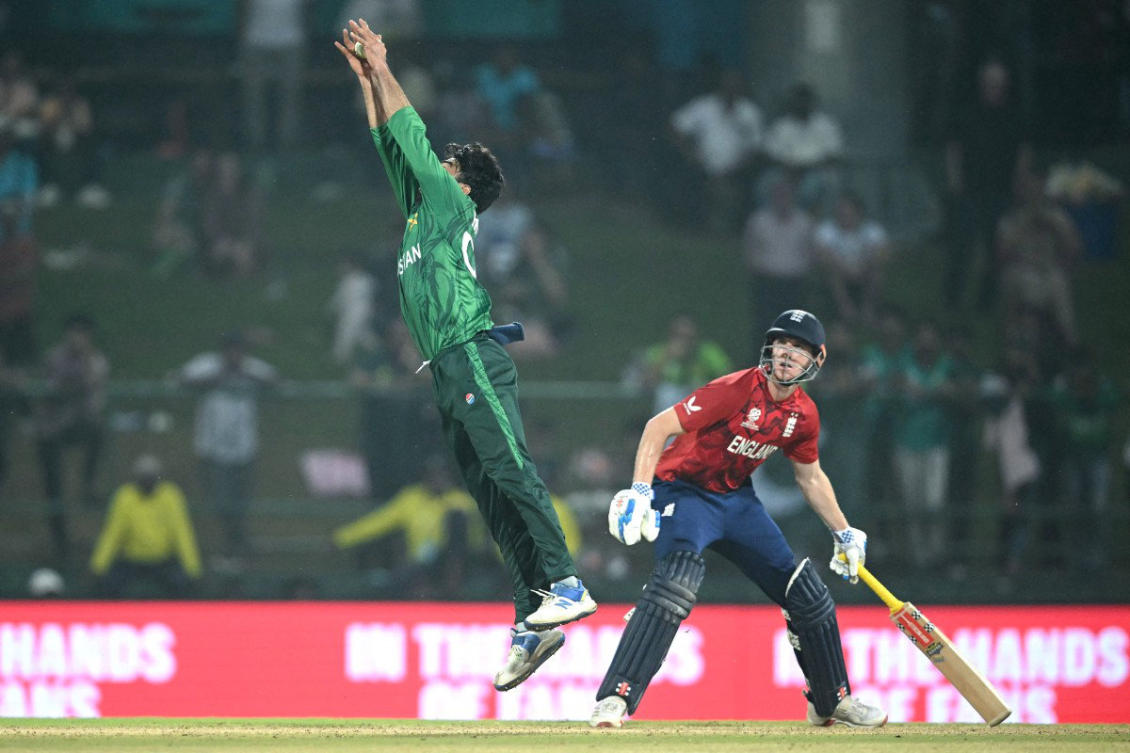Salman Mirza, left, stops a shot as England captain Harry Brooks, right, looks on during the 2026 ICC Men’s T20 Cricket World Cup Super Eights match between England and Pakistan Tuesday. (AFP)