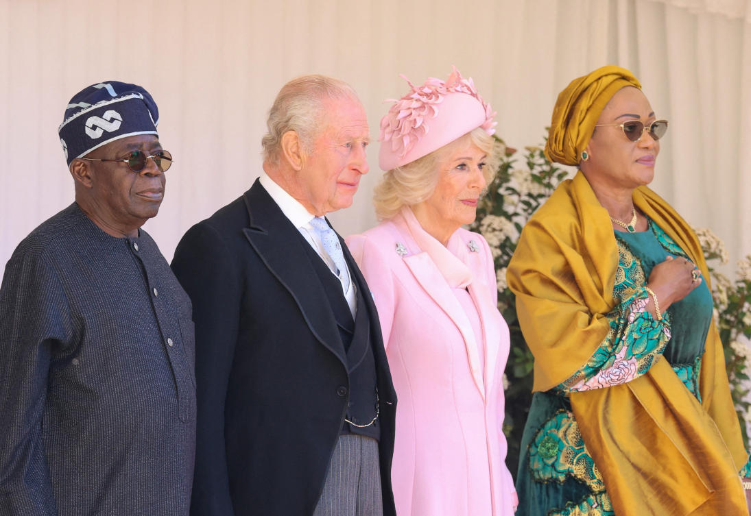 President of Nigeria Bola Ahmed Tinubu, King Charles III, Queen Camilla and First Lady Oluremi Tinubu on the dais in the Quadrangle at the inspection of the Guard of Honour during a ceremonial welcome at Windsor Castle on the first day of State Visit by Nigerian President on Mar. 18, 2026 in Windsor. (Reuters)