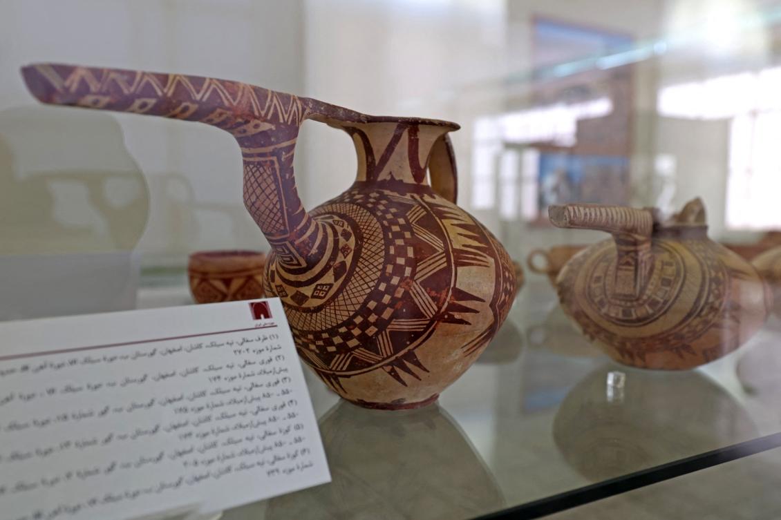 Colored potteries from the Susa period are on display at the National Museum of Iran in the capital Tehran on September 19, 2021. (File/AFP)