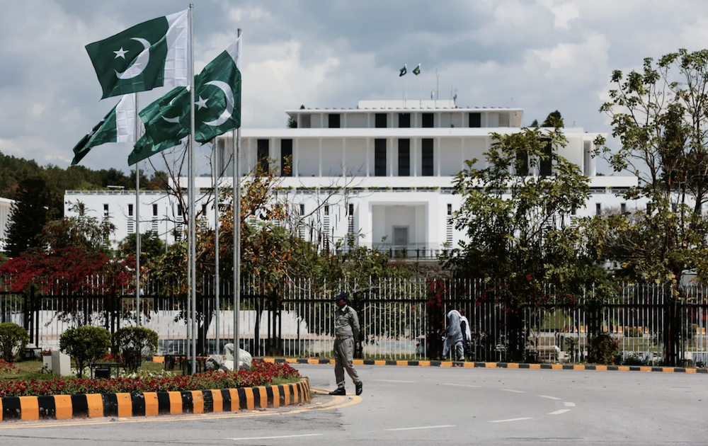 A security guard patrols outside the Presidential Palace on April 9 ahead of Iran–US talks in Islamabad. (Reuters)
