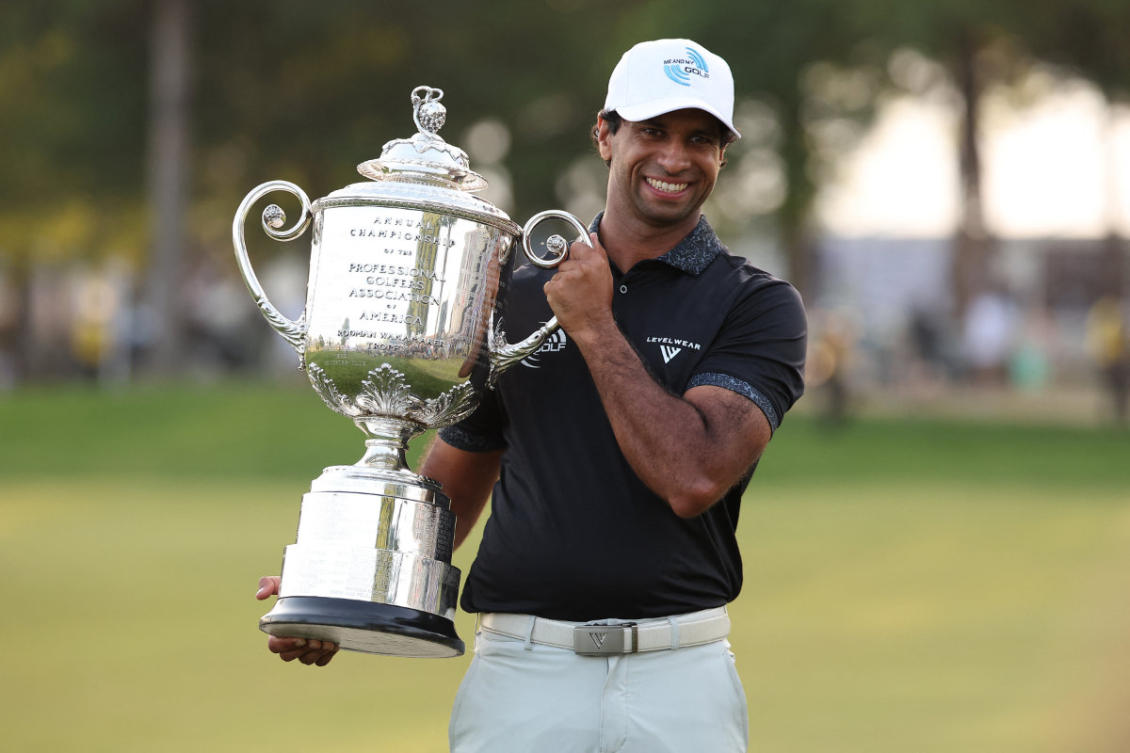 Aaron Rai poses with the trophy after winning the final round of the PGA Championship golf tournament on May 17, 2026, in Newtown Square, Pennsylvania, . (Bill Streicher-Imagn Images)