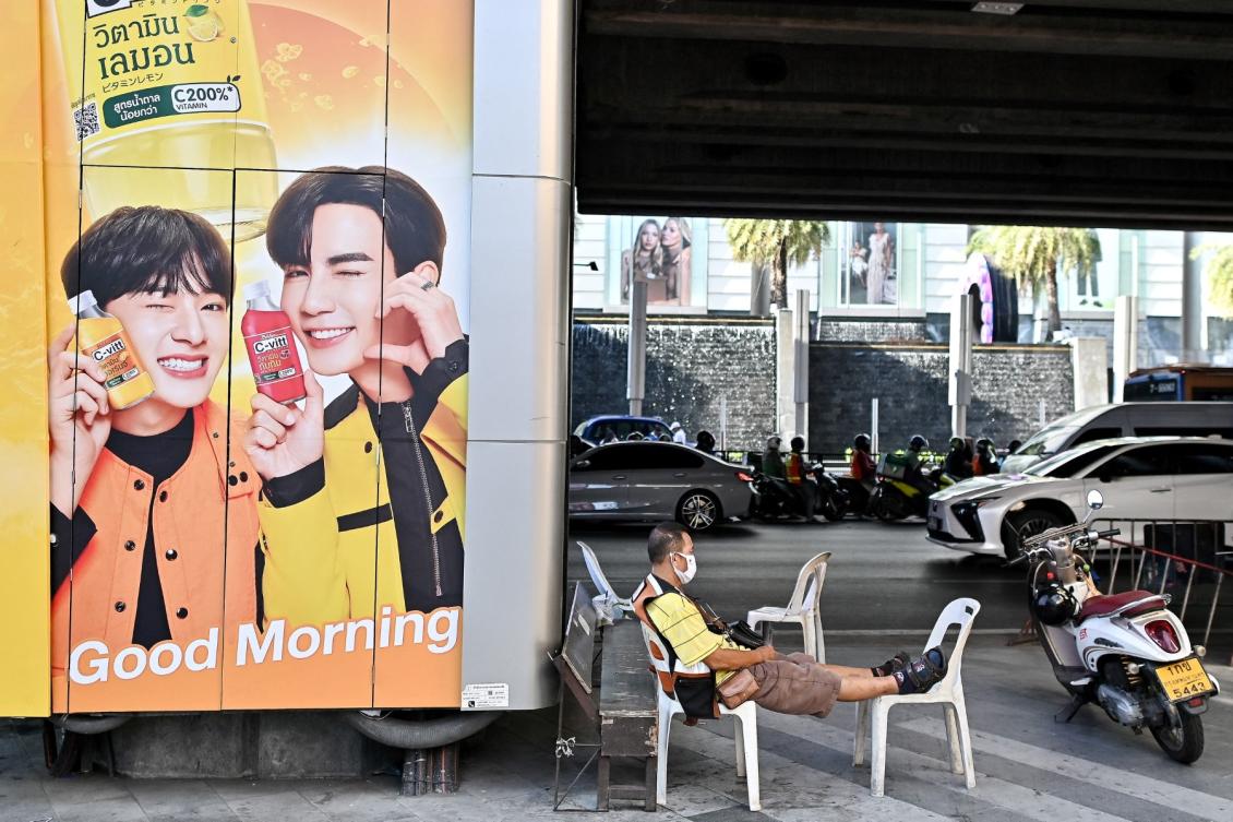 Manasawin Nantasen was driving his vehicle across a bridge in Bangkok in October 2024 when he hit a stationary motorbike. Above, a motorbike taxi driver rests as he takes shelter from the sun under a bridge in Bangkok on April 29, 2024 (AFP file photo)