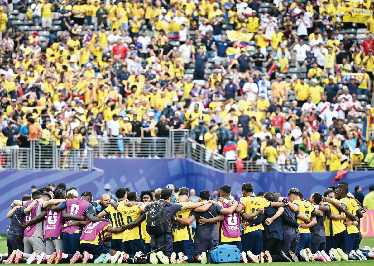 Ecuador’s players gather in a circle after winning the 2026 World Cup Group E football match between Ecuador and Germany at the New York/New Jersey Stadium in East Rutherford, New Jersey, on Friday. (AFP)