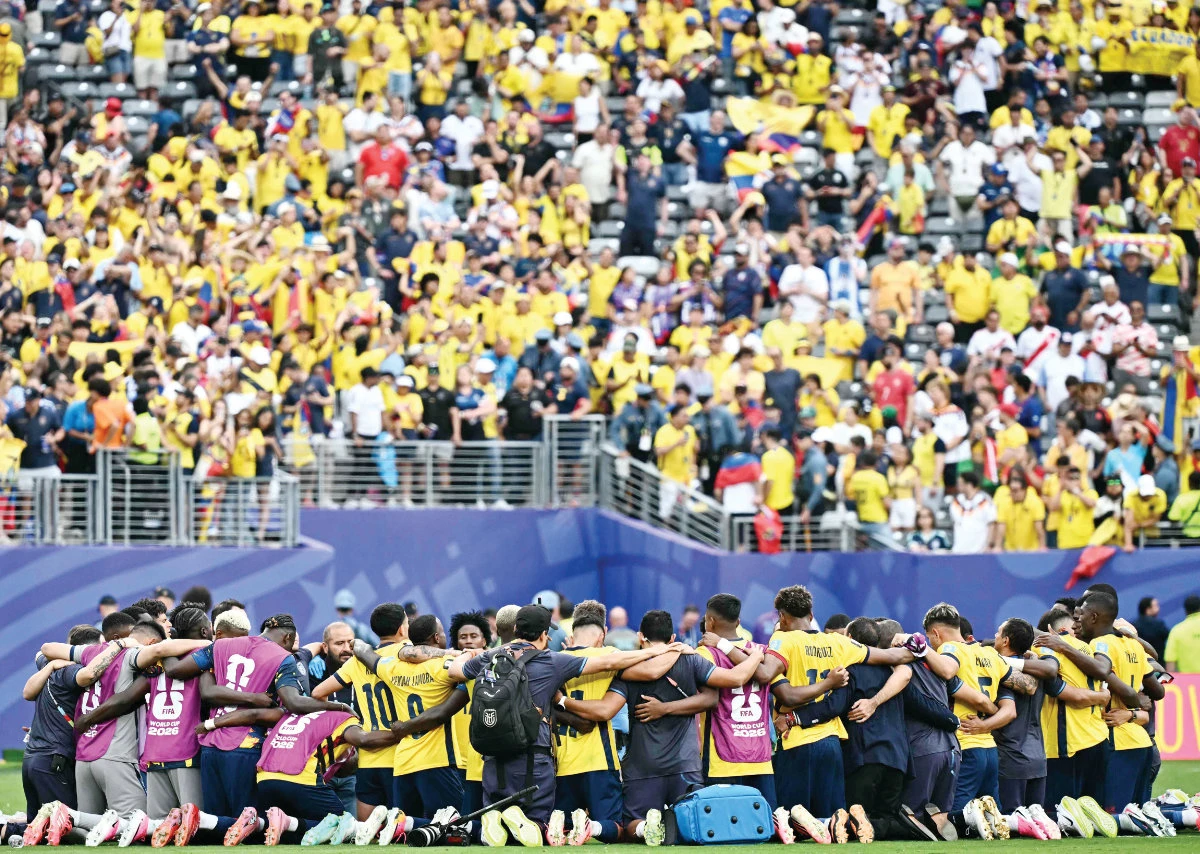 Ecuador’s players gather in a circle after winning the 2026 World Cup Group E football match between Ecuador and Germany at the New York/New Jersey Stadium in East Rutherford, New Jersey, on Friday. (AFP)