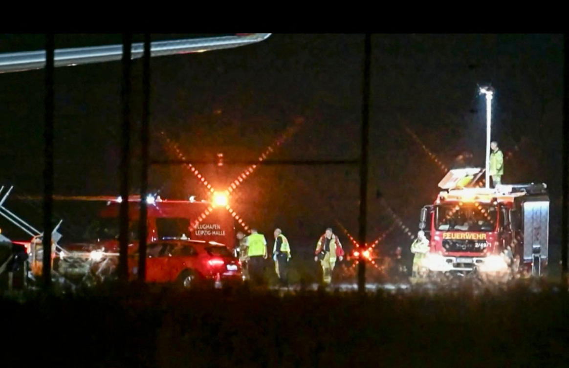 A video grab taken from a video footage by News5 from August 5, 2026 shows emergency services, police and firefighers deployed at German airport Leipzig-Halle in Schkeuditz, eastern Germany, after a drone was spotted nearby. (AFP photo)