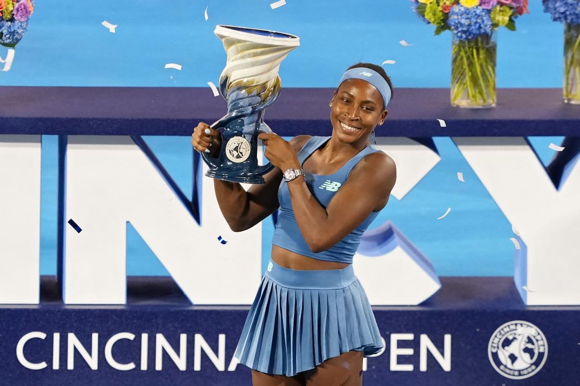 Coco Gauff poses for photos with the Rookwood Cup after defeating Jessica Pegula to win the women’s singles title during the final day of the Cincinnati Open on August 23, 2026. (Getty Images via AFP)