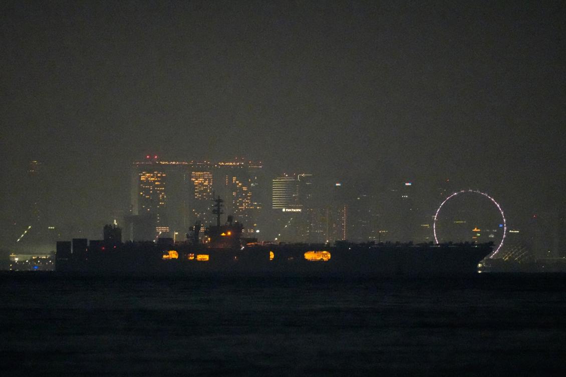 Above, the US Navy aircraft carrier USS Abraham Lincoln sails past Singapore as seen from Batam, Indonesia on Aug. 30, 2026. (AP)