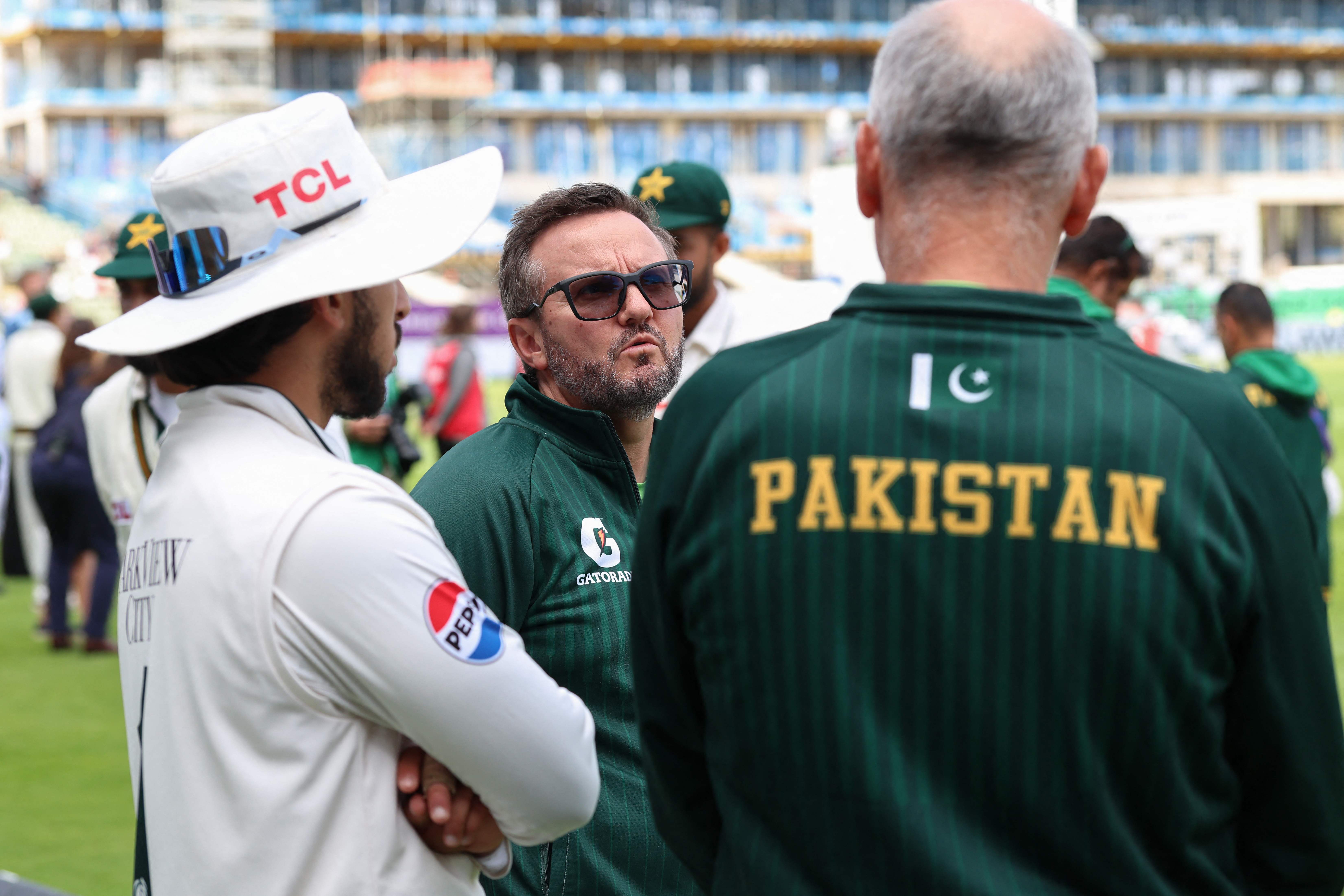 Pakistan’s head coach Mike Hesson (center) speaks at the conclusion of day four in the third Test match against England at Edgbaston in Birmingham on September 12, 2026. (AFP)