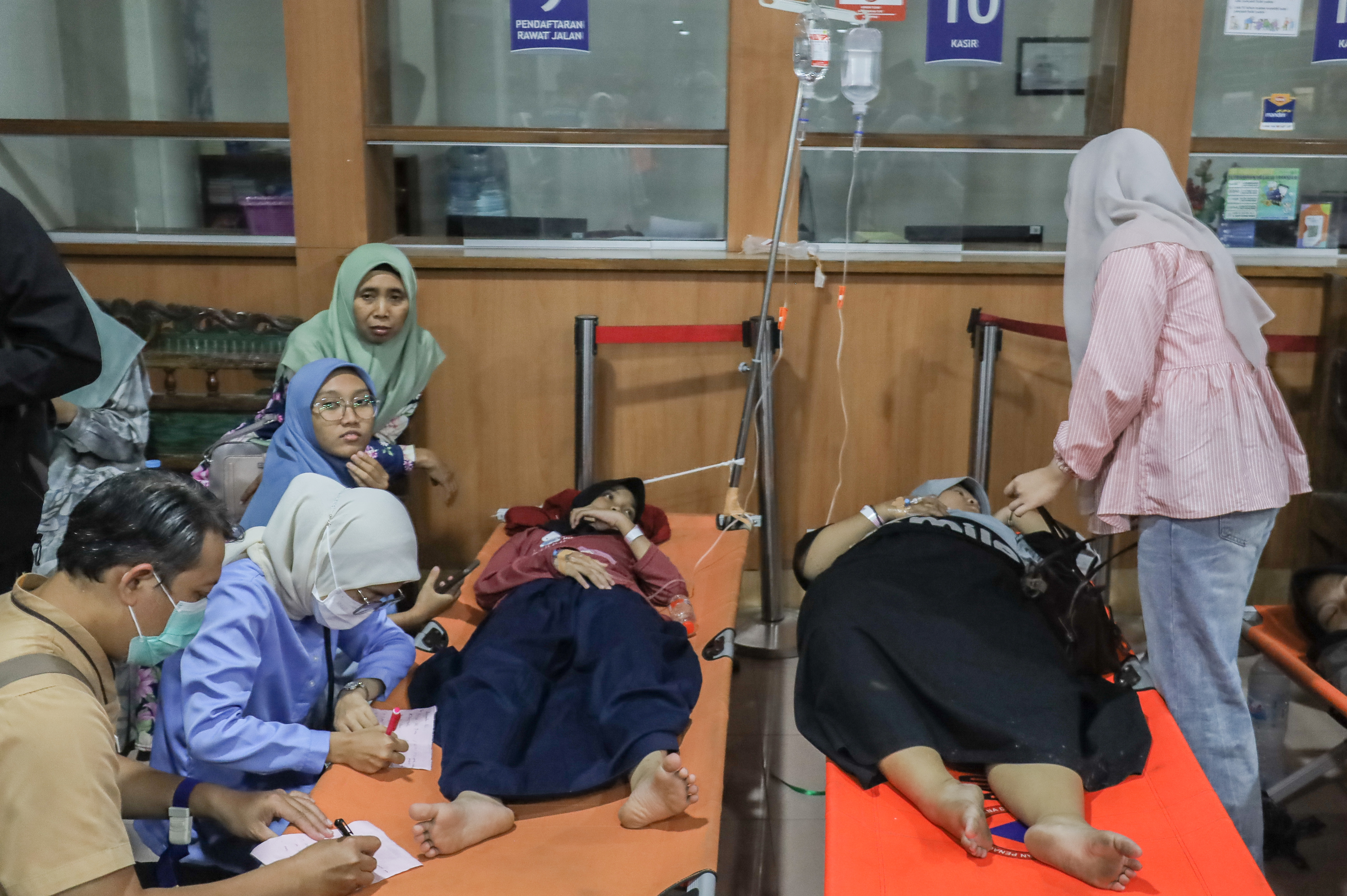 Nearly 2,000 fall ill in suspected food poisoning linked to Indonesia's free school meals program