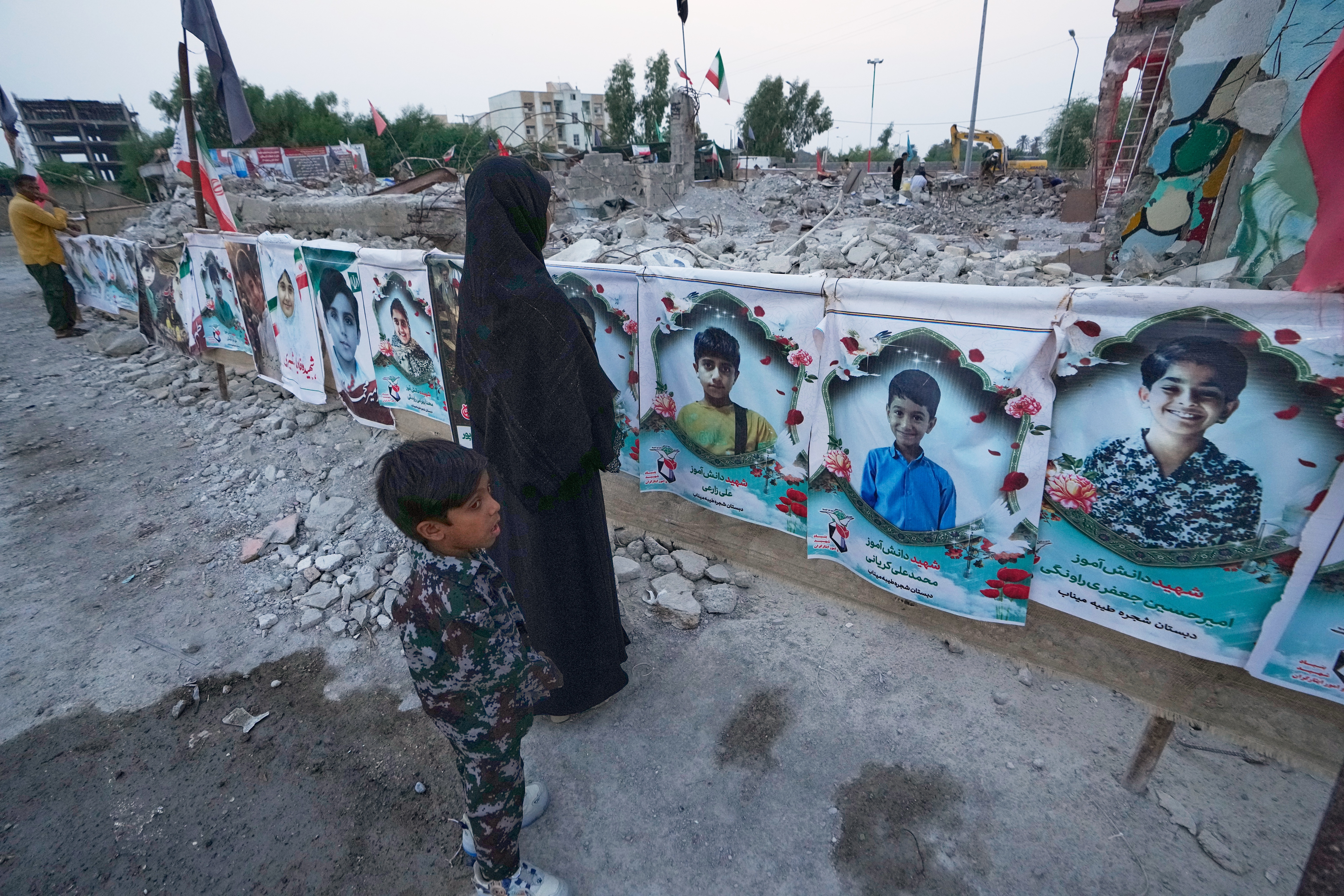 Families grieve in ruins of Iranian school where a US strike killed dozens of children