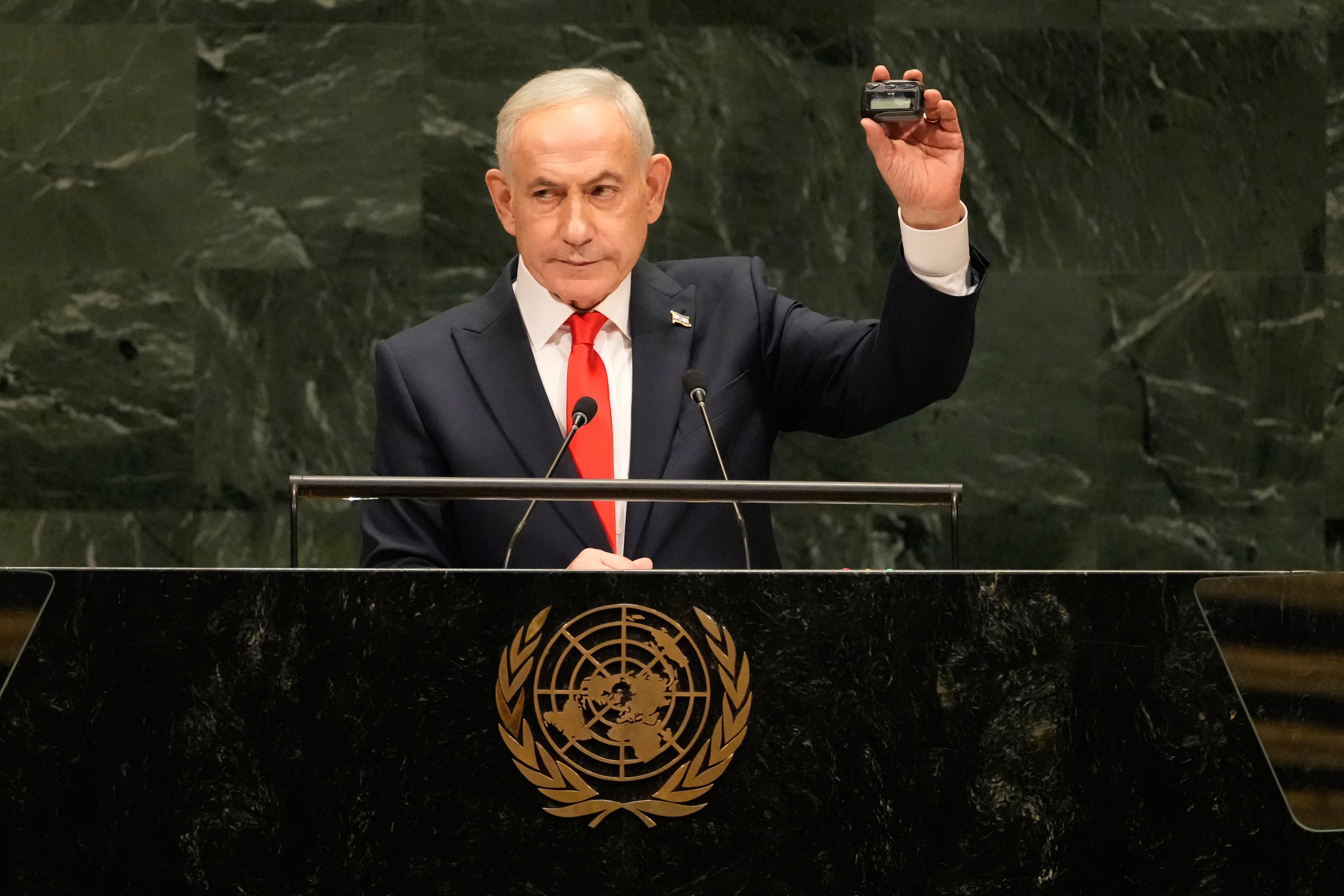 Israeli Prime Minister Benjamin Netanyahu holds a pager device during his UN address in reference to the "exploding pager" attacks on Hezbollah in Lebanon. (AP)