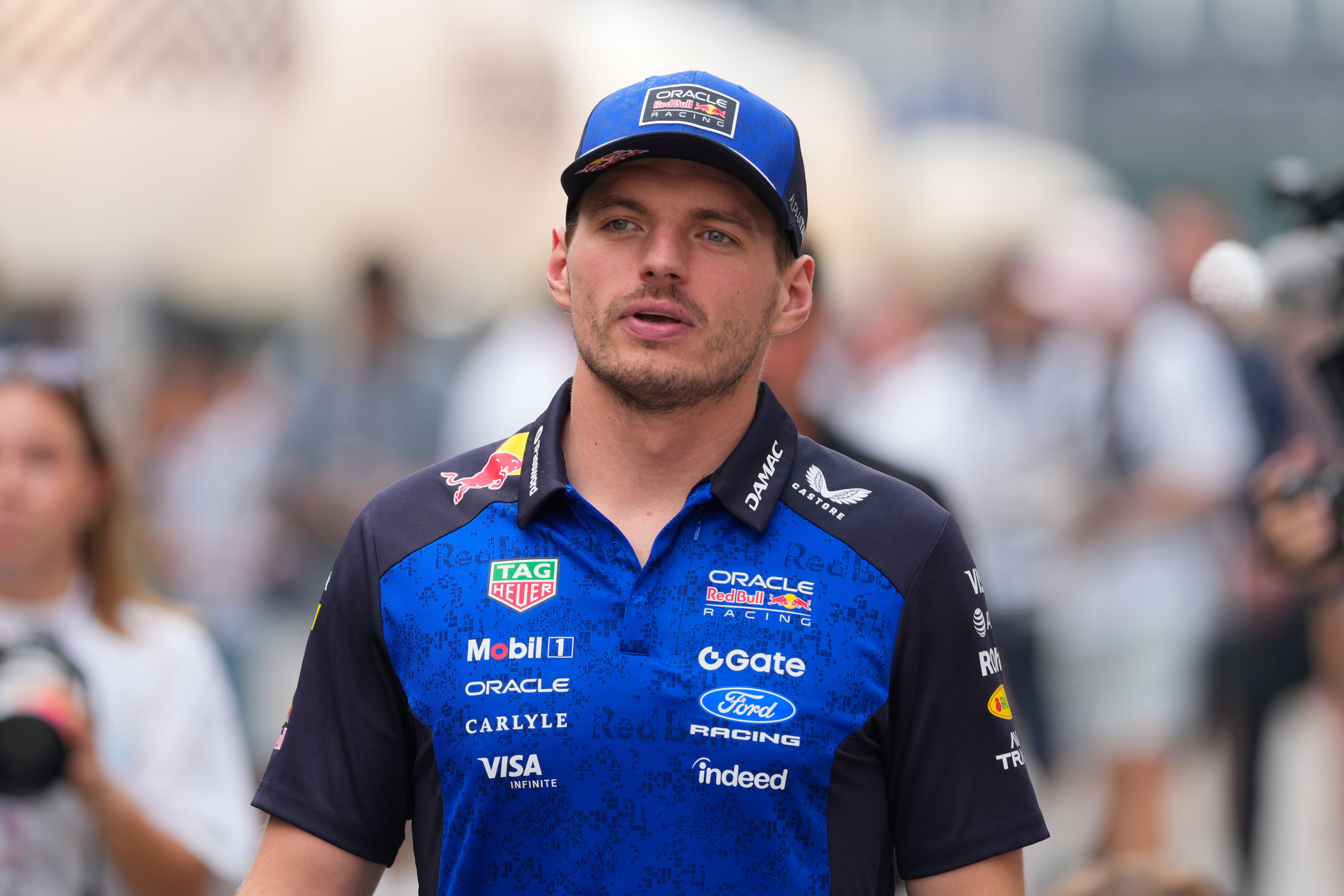 Red Bull driver Max Verstappen of the Netherlands gestures as he arrives at the paddock ahead of the Singapore Formula One Grand Prix at the Marina Bay Street Circuit in Singapore, Thursday, Oct. 8, 2026. (AP Photo/Vincent Thian)
