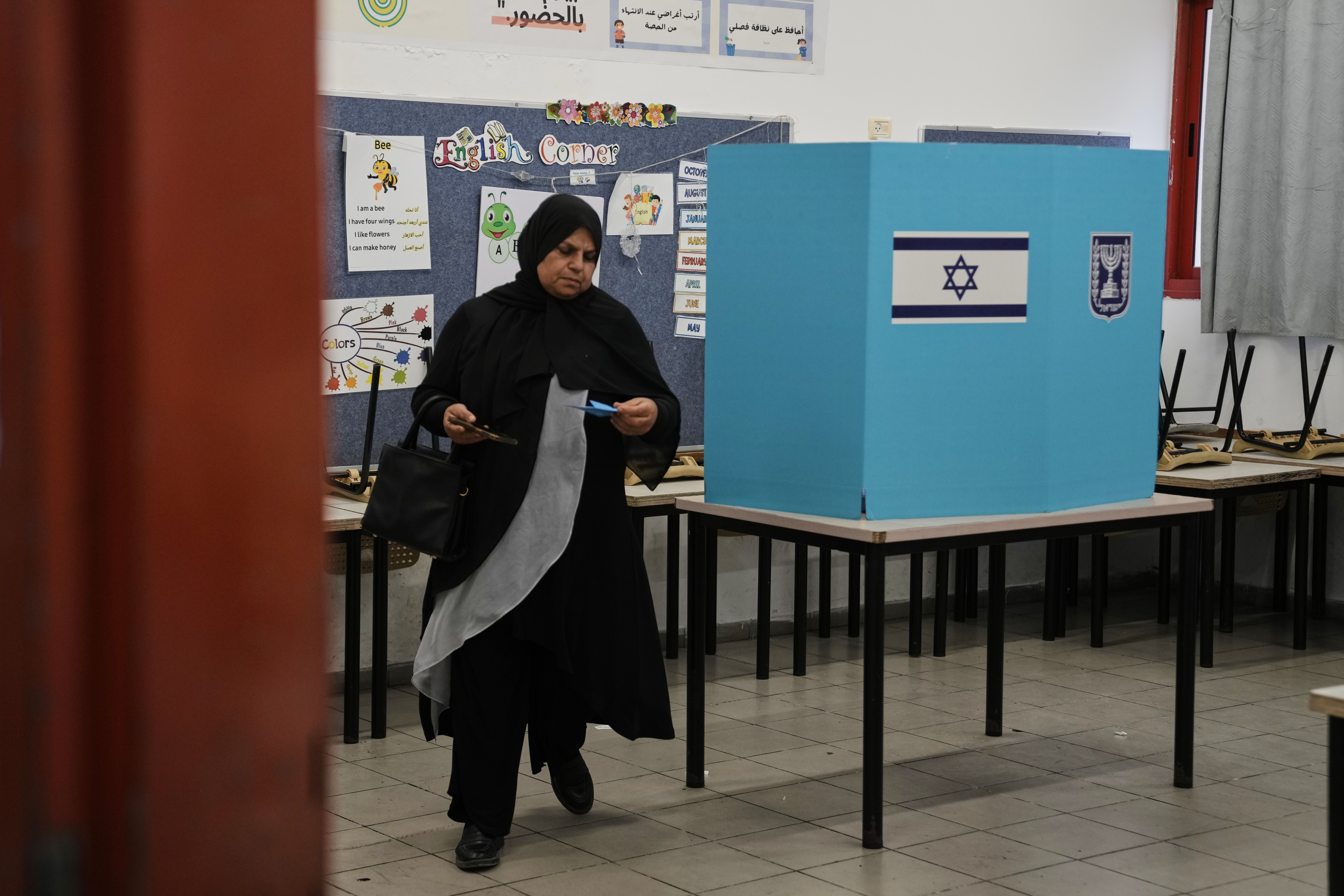 A Palestinian citizen of Israel casts her ballot in the country's general election at a polling station in Umm al-Fahm, Israel, Tuesday, Oct. 27, 2026. (AP)