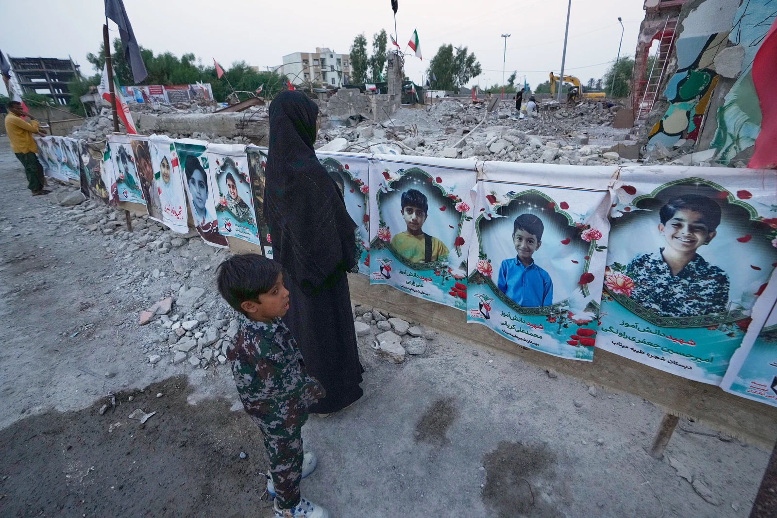 Families grieve in ruins of Iranian school where a US strike killed dozens of children