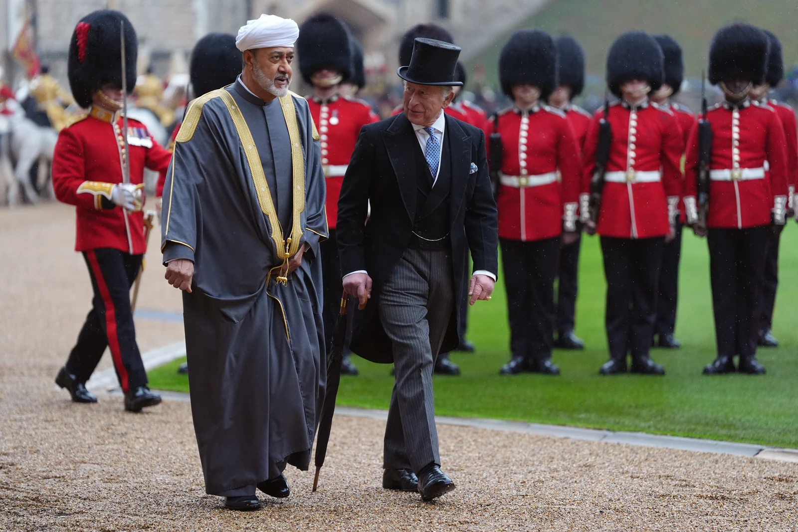 Britain's King Charles III, right, and Sultan Haitham bin Tarik of Oman, left, attend a ceremonial at Windsor Castle, Berkshire, England, Tuesday, Oct. 20, 2026. (AP)